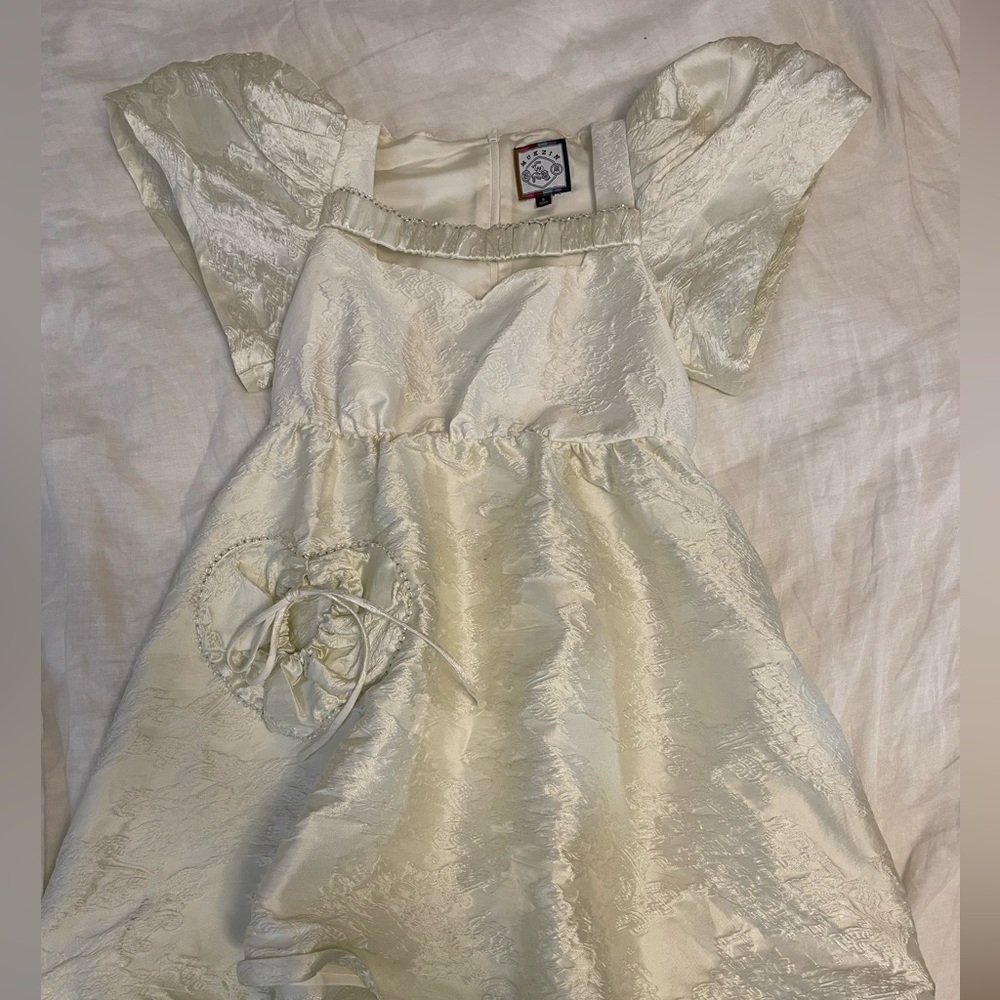 Mukzin white baby doll dress with chest strap and heart pocket